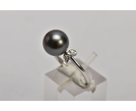 A 9CT WHITE GOLD CULTURED PEARL AND DIAMOND RING, designed with a single cultured black pearl, round brilliant cut diamond de