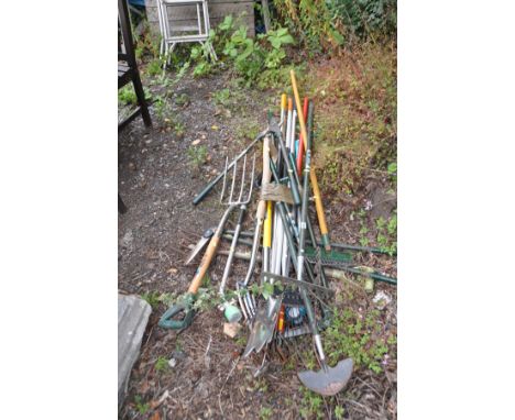 A COLLECTION OF GARDEN TOOLS including stainless steel spade and fork, loppers, rakes, hoes etc