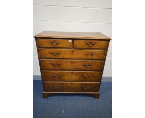 A GEORGIAN OAK CHEST OF TWO SHORT OVER FOUR GRADUATED DRAWERS, drop handles, on bracket feet, width 105cm x depth 50cm x heig