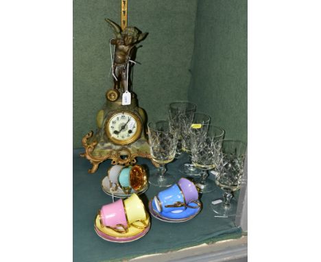 A LATE 19TH CENTURY BRONZED SPELTER, GILT METAL AND ONYX MANTEL CLOCK, cupid finial, enamel dial with Arabic numerals, eight 