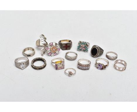 A BAG OF SILVER AND WHITE METAL RINGS, to include a large silver cluster ring, set with white, pink and colourless cubic zirc