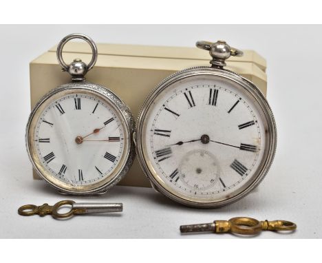 TWO EARLY 20TH CENTURY SILVER OPEN FACE POCKET WATCHES, both with white faces and black Roman numerals, the larger pocket wat