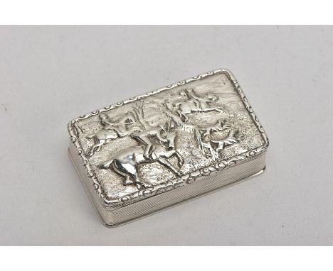 A SILVER TABLE SNUFF BOX, embossed fox hunting scene to the lid, engine turned design to the sides and base, gilt interior, h