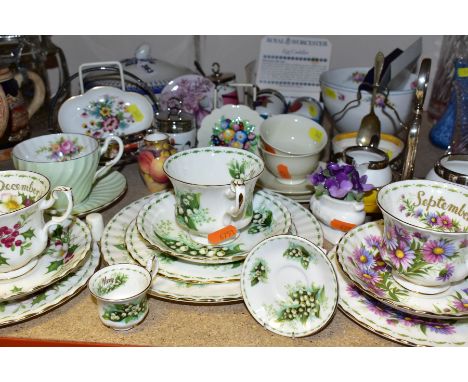 A GROUP OF CERAMICS, comprising Royal Albert Flowers of The Month December and September trios and May trio with additional 2