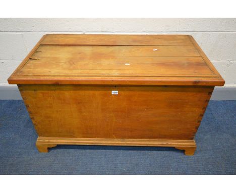 A PINE BLANKET CHEST, on bracket feet, width 105cm x depth 55cm x height 62cm (condition - top split, in need of attention)