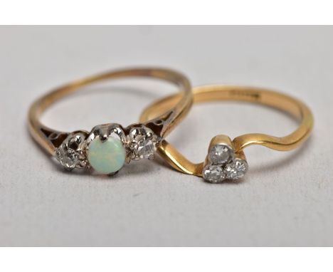 TWO YELLOW METAL DIAMOND SET RINGS, the first set with three old cut diamonds, within collet mounts, total estimated diamond 