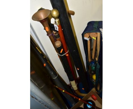 A GROUP OF WALKING STICKS, FISHING TACKLE AND CROWN GREEN BOWLING BALLS, etc, to include a horn handled malacca riding crop, 