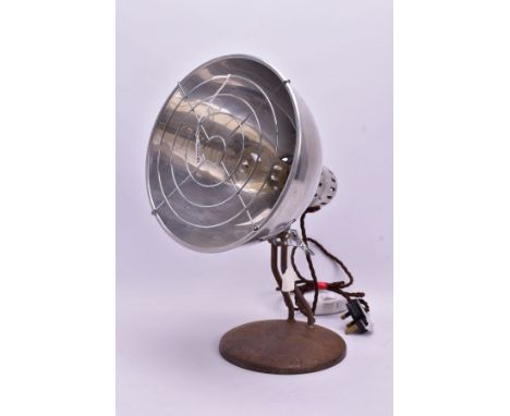 A VINTAGE HEAT LAMP, the converted light fitting within a stainless steel shade, on a circular metal base (PAT pass and worki