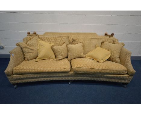 A WALNUT AND GOLD UPHOLSTERED DURESTA HORNBLOWER KNOWLE SOFA, with drop ends to each end, on chrome casters, length 233cm x d