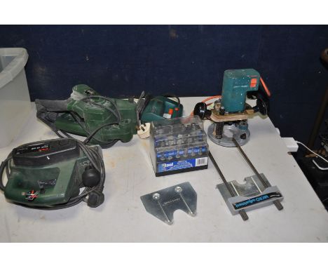 A BOSCH PHO 15-82 ELECTRIC PLANER, a Toledo Electric belt sander, a Black and Decker jigsaw and a Black and Decker Woodworker