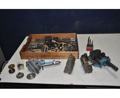 A TRAY CONTAINING LATHE TOOLS including chuck jaws, knurling tools, cutting bit, cutter carriages, gears , a machine vice etc