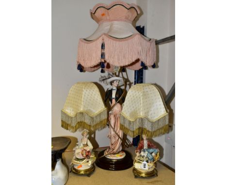 A FLORENCE GUISEPPE ARMANI FIGURAL TABLE LAMP AND A PAIR OF CAPODIMONTE TABLE LAMPS, the Florence lamp with fabric shade abov