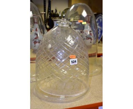 A PAIR OF BELL SHAPED GLASS DOMES/LIGHT SHADES AND ANOTHER GLASS DOME, the pair with holes to the top, possibly for science p