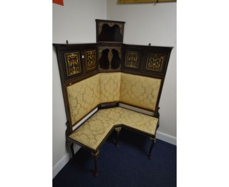 AN EDWARDIAN MAHOGANY AND MARQUETRY INLAID CORNER SOFA, the top section with four panels flanking two levels of open shelving