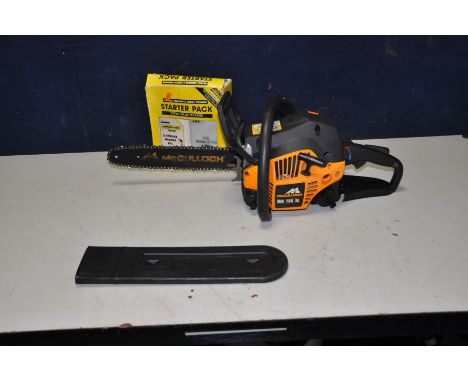 A McCULLOCH MAC738 PETROL CHAINSAW with 32cm cut (engine pulls freely but hasn't been started) with mixture bottle starter pa