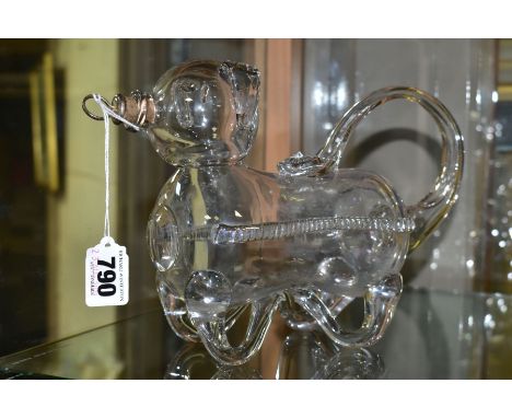 A NOVELTY GLASS DECANTER IN THE FORM OF A BEAR OR GIN PIG, free blown form with cork and metal stopper, length 25cm x height 
