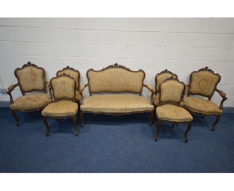 A LOUIS XV STYLE MAHOGANY SEVEN PIECE SALON SUITE, comprising a sofa with open armrests, pair of armchairs, and four chairs (