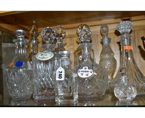 TEN CUT AND PRESSED GLASS DECANTERS AND BOTTLES, five with named porcelain decanter labels, one small example by Burns Crysta