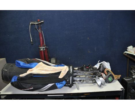 A GOLF BAG CONTAINING MOSTLY PING GOLF CLUBS, including Ping Zing 2 irons 3 to 9, a Taylor Made Titanium 5 driver, trolley, s