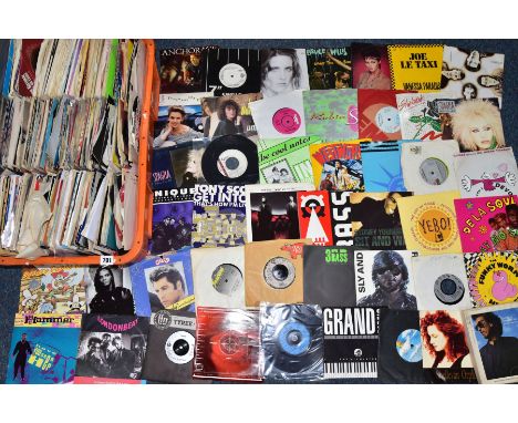 A TRAY CONTAINING OVER FOUR HUNDRED 7in SINGLES AND Eps artists include Elvis Presley, George Harrison, Gary Numan, Carter US