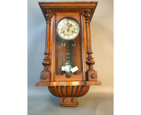 A Victorian Vienna wall clock with key and pendulum [62.5Cm] 