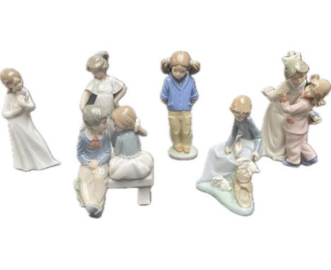 A collection of various Nao figures; attending the rabbits &amp; children sitting on bench 