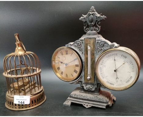 A  Victorian cast iron barrel clock and barometer with foliate cast base and central column, the circular brass housed clock.