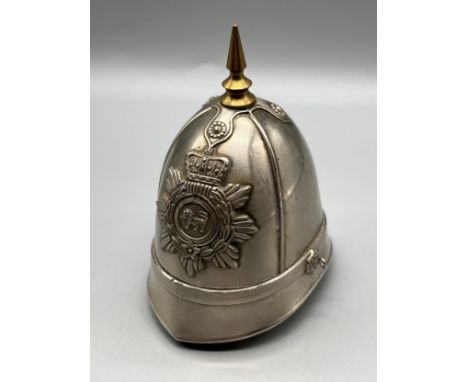 Vintage Police helmet table top lighter with brass spike finial. 