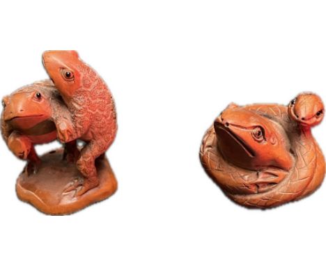 Two carved Japanese boxwood netsuke frogs, Signed and fitted with black bead eyes. [5cm] 