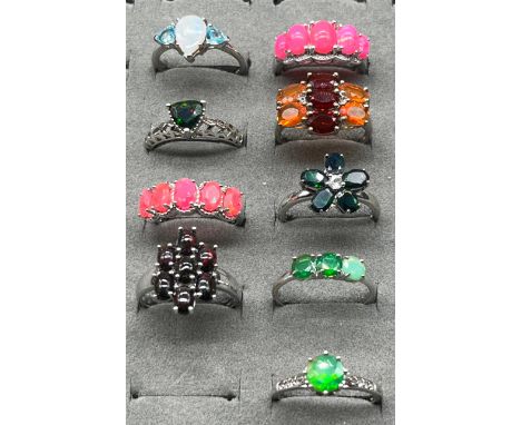 A Lot of Nine 925 silver, opal, fire opal and opalescent stone rings. 