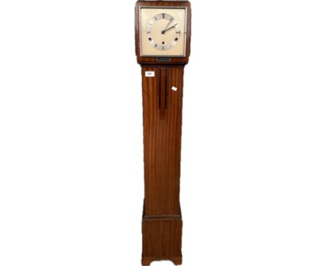 An art deco grand mother clock with pendulum &amp; key 