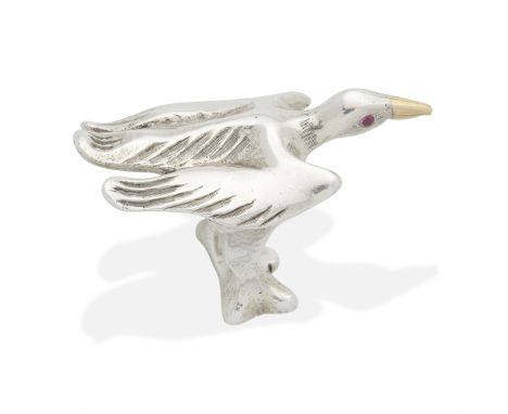 MOSHEH OVED: SILVER BIRD RING, CIRCA 1950Modelled as a bird in flight with gilded beak, engraved feathers, and ruby-set eyes,