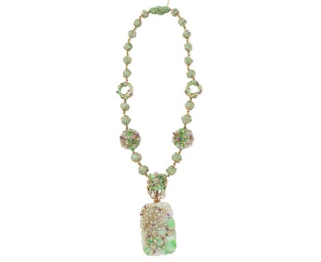 JADE, DIAMOND AND RUBY NECKLACE, 1963The jade spheres interspersed with jade hoops and carved jade plaques, enclosed within 1