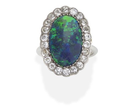 OPAL AND DIAMOND CLUSTER RINGThe opal cabochon, within an old brilliant-cut diamond surround, ring size approx. H½For further