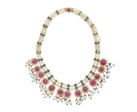 INDIAN GEM-SET AND PEARL FRINGE NECKLACE, LATE 19TH CENTURYThe three rows of seed pearls, interspersed with emerald and rose-