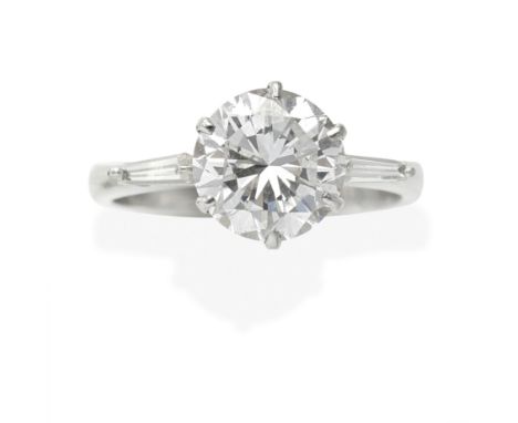 DIAMOND SINGLE-STONE RINGThe brilliant-cut diamond, between baguette-cut diamond shoulders,  principal diamond approx. 2.05ct