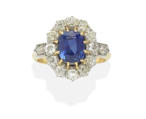 SAPPHIRE AND DIAMOND CLUSTER RINGThe oval-cut sapphire within a cushion-shaped diamond surround, sapphire approx. 1.60cts, di
