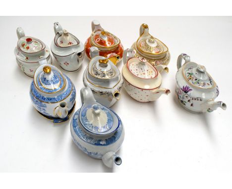 Nine oval teapots, by Miles Mason; Spode; and others.