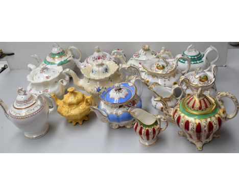 Eleven footed teapots, 19th Century, one by William Adams, with sucrier and milk jug, decorated with landscape scenes.  (14)