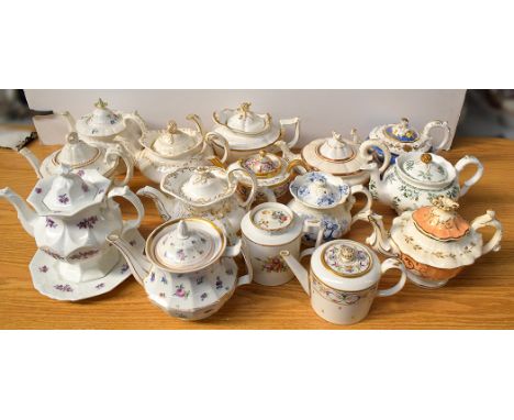 Fifteen teapots, mainly 19th Century, one on stand, makers include: Spode; Paris La Courtille; Berlin; and Schumann Porz.  (1