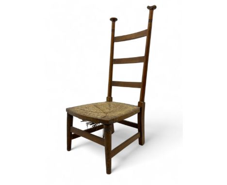 Attributed to William Birch of High Wycombe - Arts & Crafts oak ladder-back side chair, with turned finials, rush seat, and s