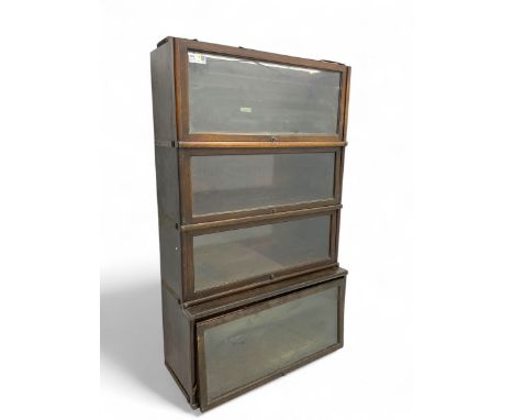 Globe Wernicke - early 20th century oak four-tier stacking library bookcase, four glazed sections enclosed by hinged and slid