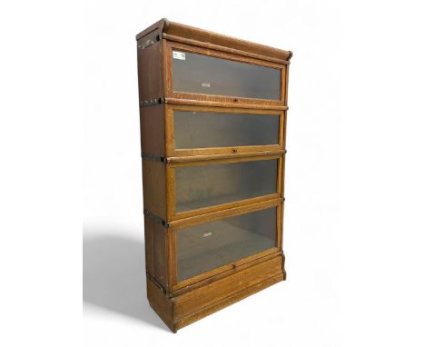 Globe Wernicke - early 20th century oak four-tier stacking library bookcase, four glazed sections enclosed by hinged and slid