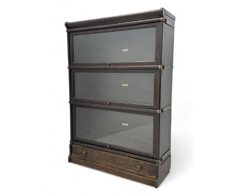 Globe Wernicke - early 20th century oak three-tier stacking library bookcase, three glazed sections enclosed by hinged and sl