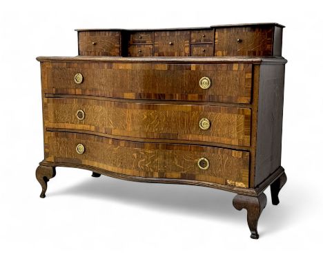Late 19th century continental oak commode, serpentine fronted with parquetry and crossbanded decoration, the raised superstru