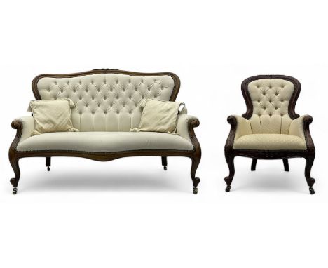 Victorian walnut framed sofa, button-tufted back and scroll arms, upholstered in cream fabric, raised on cabriole supports wi