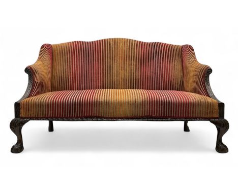 Mid-19th century mahogany two-seat sofa, upholstered in striped velvet fabric, the shaped backrest leading to outward-curved 
