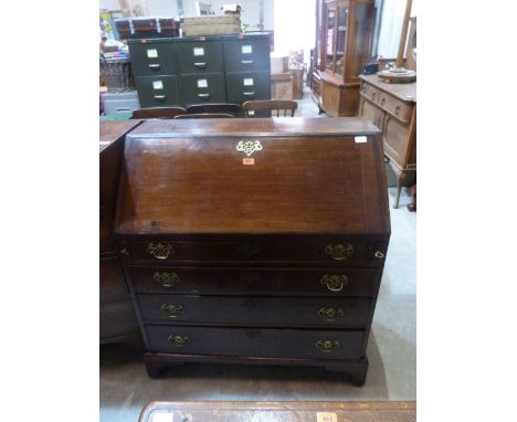 A George III mahogany bureau with four long graduated drawers on bracket feet. 37' wide