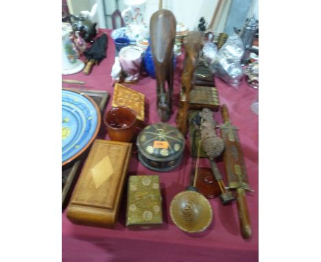 Carved wood and other treen including boxes, tea tray, cribbage board etc. together with a ceramic charger