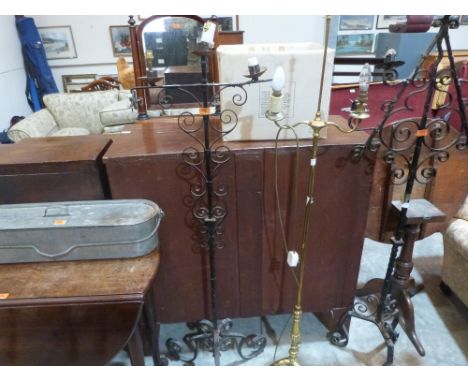 Three metal lamp standards and a fish kettle